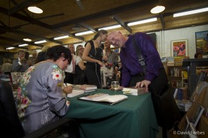 Lyn signing her book, Flock, for a guest